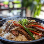 Sizzling Pepper Steak with Onions is not just a meal; it's an experience that tantalizes the senses. This dish combines tender slices of steak with vibrant, colorful vegetables, all tossed together in a savory, aromatic sauce that fills your kitchen with delightful fragrances. The appeal of this recipe lies in its bold flavors and satisfying textures, making it a favorite among food enthusiasts and busy home cooks alike.